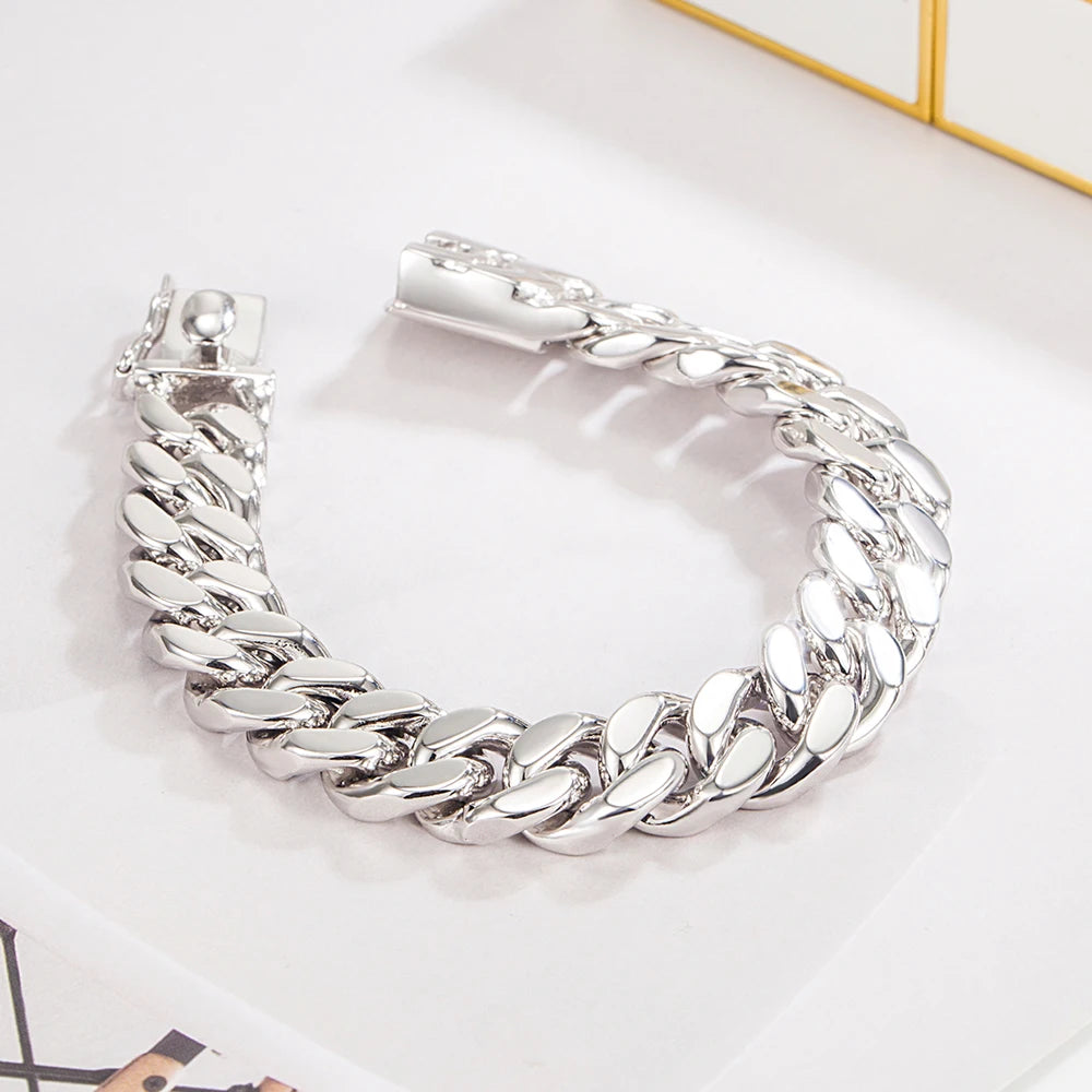 Silver chain bracelet on a light gray background