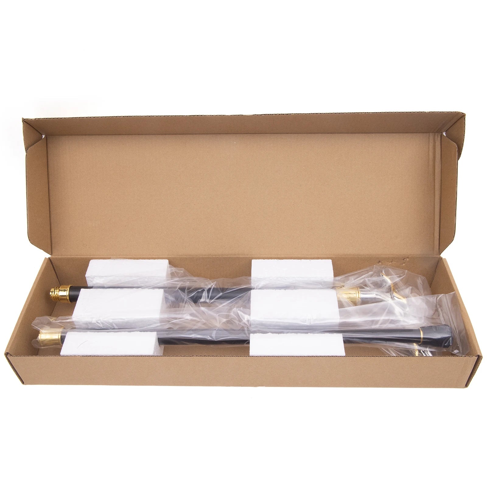 Open cardboard box containing a set of pipes.