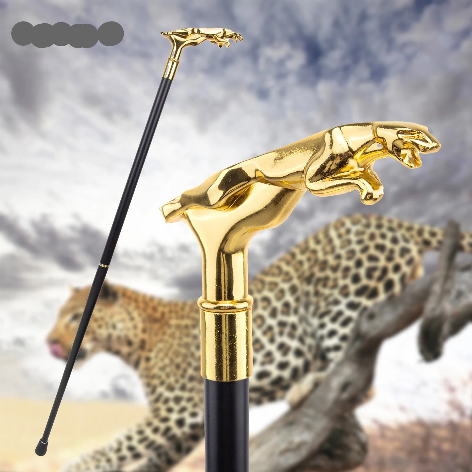 Gold walking cane with leopard design against a blurred natural background