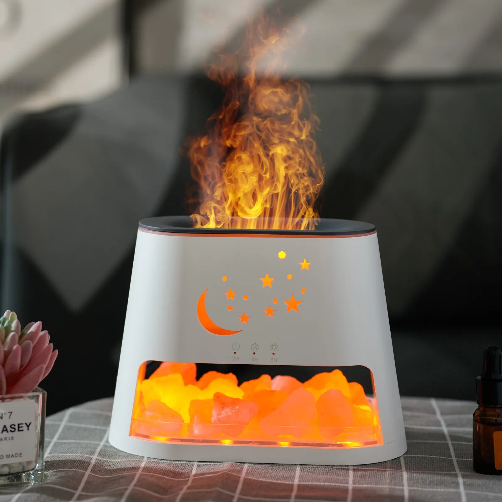 Faux flame lamp with decorative elements on a table