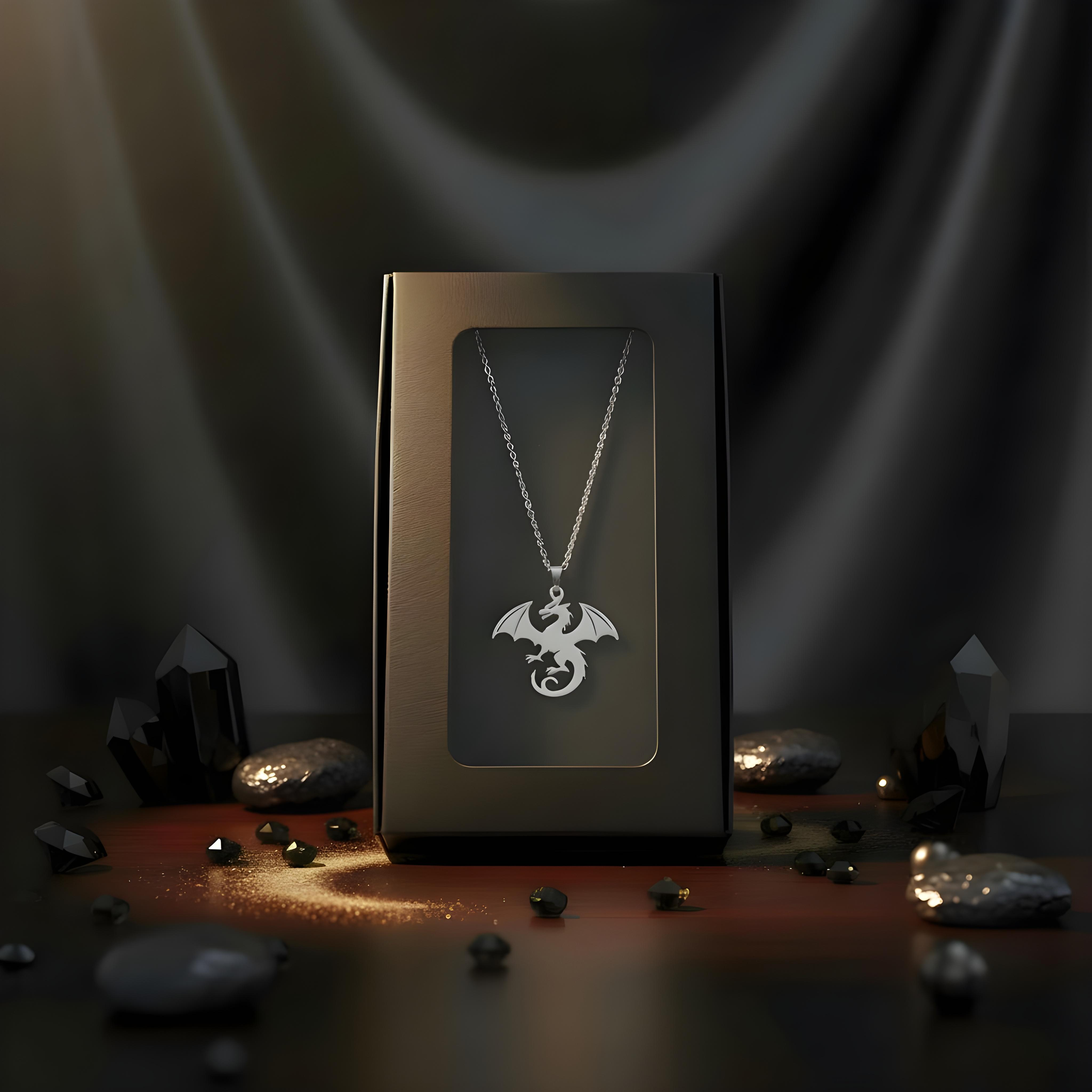 Silver dragon necklace in a black box with a dark, mystical background