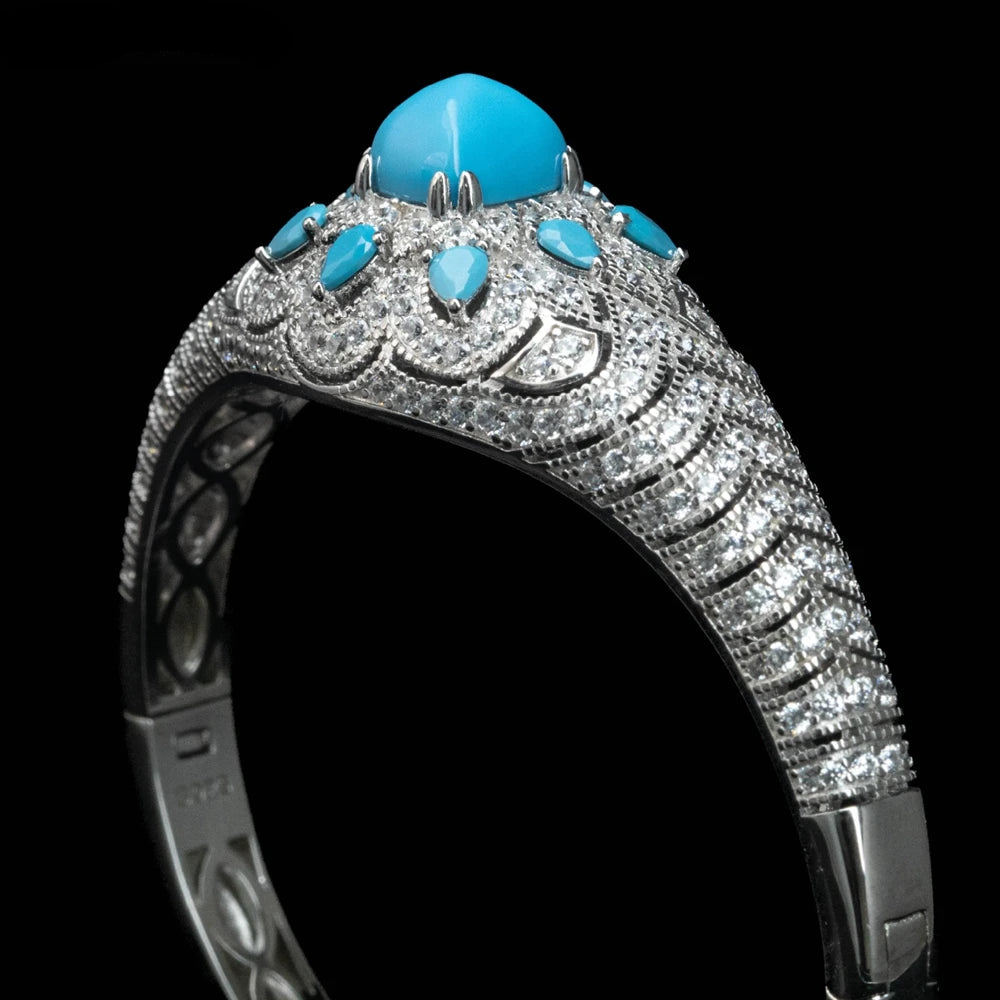Luxury bracelet with turquoise stones and silver accents on a black background,.