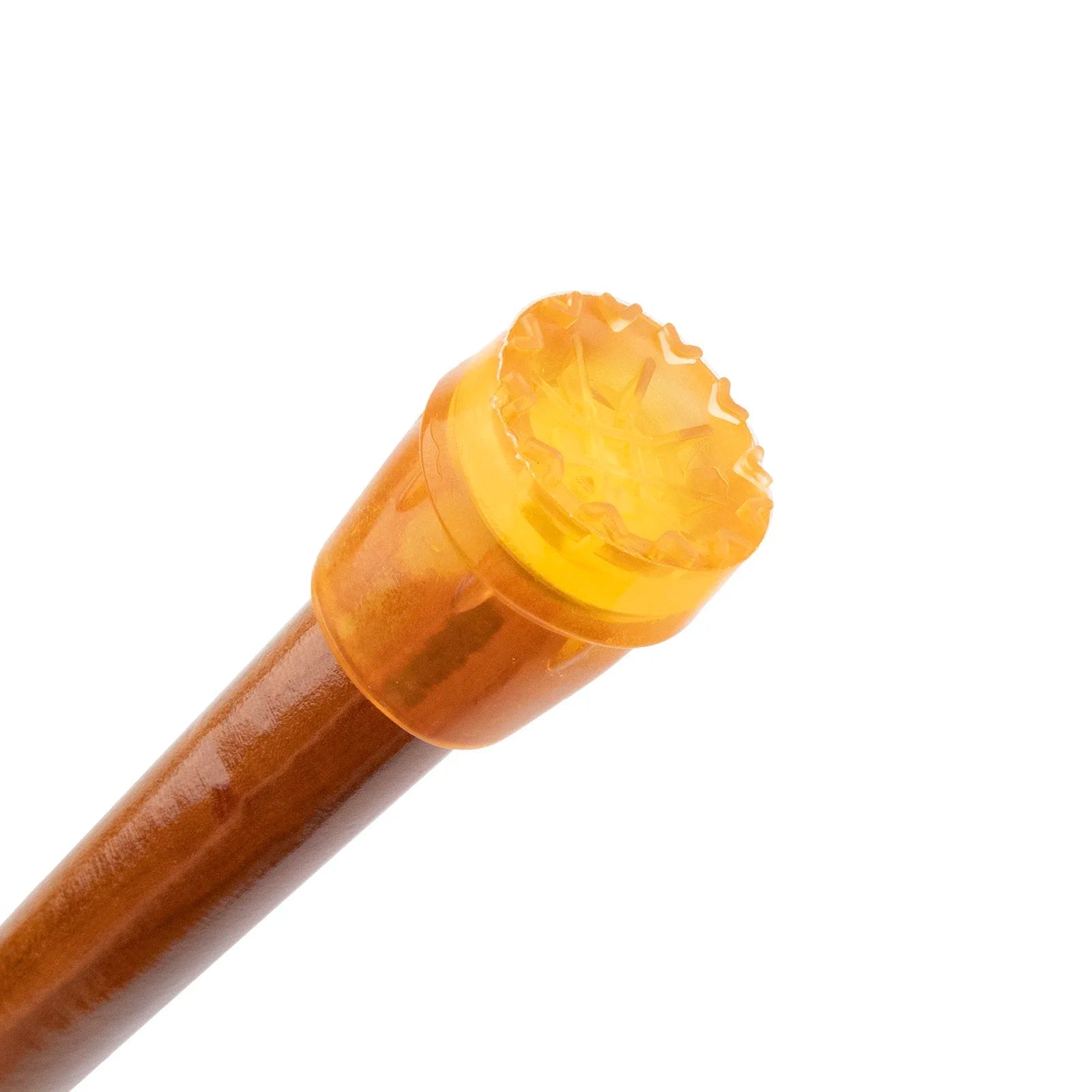 Wooden stick with a yellow cap on a white background