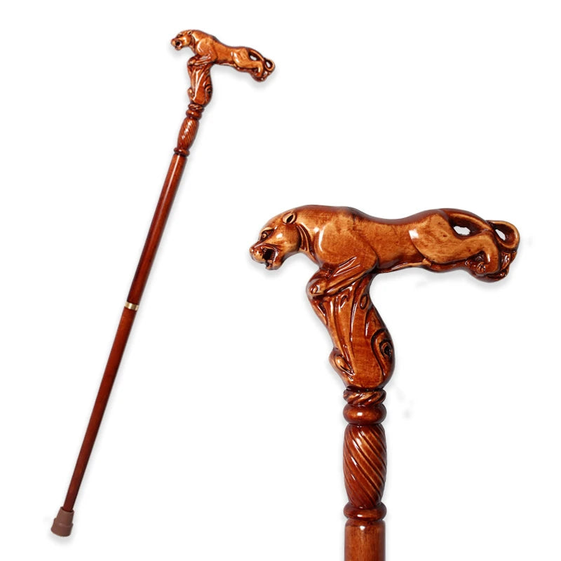 Wooden walking cane with a carved panther handle on a white background