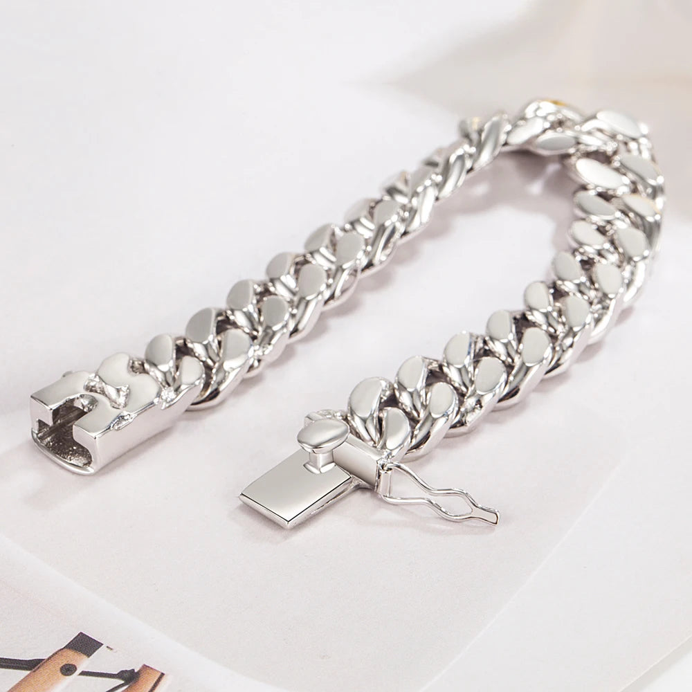 Silver chain bracelet with a lock charm on a light background