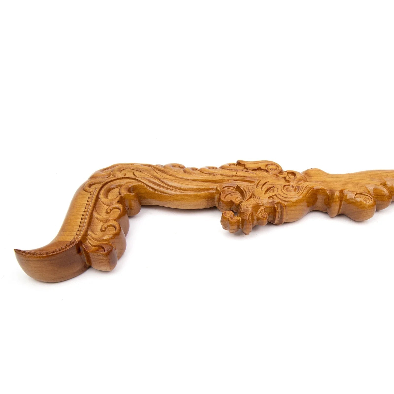 Decorative wooden handle with intricate carvings on a white background.